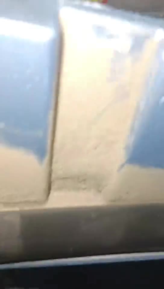 The installer points out the internal gap used to pass the cable through.