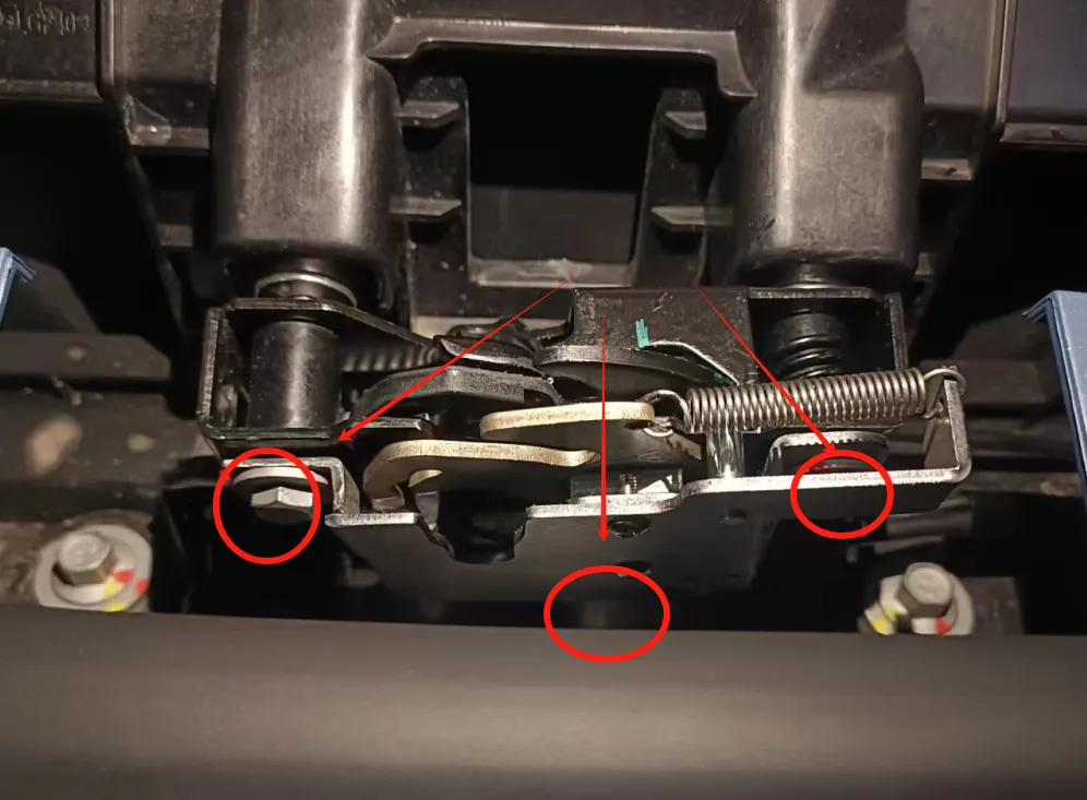 Original reference image: the three red circles/arrows identify the factory latch mounting points.